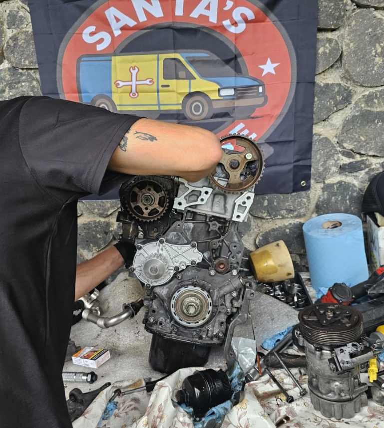 Auto mechanic hands using wrench to repair auto engine. Car maintenance, service at garage. Technician inspects vehicle for problems. Auto repair, fixing, check, services, insurance, checkup concept.